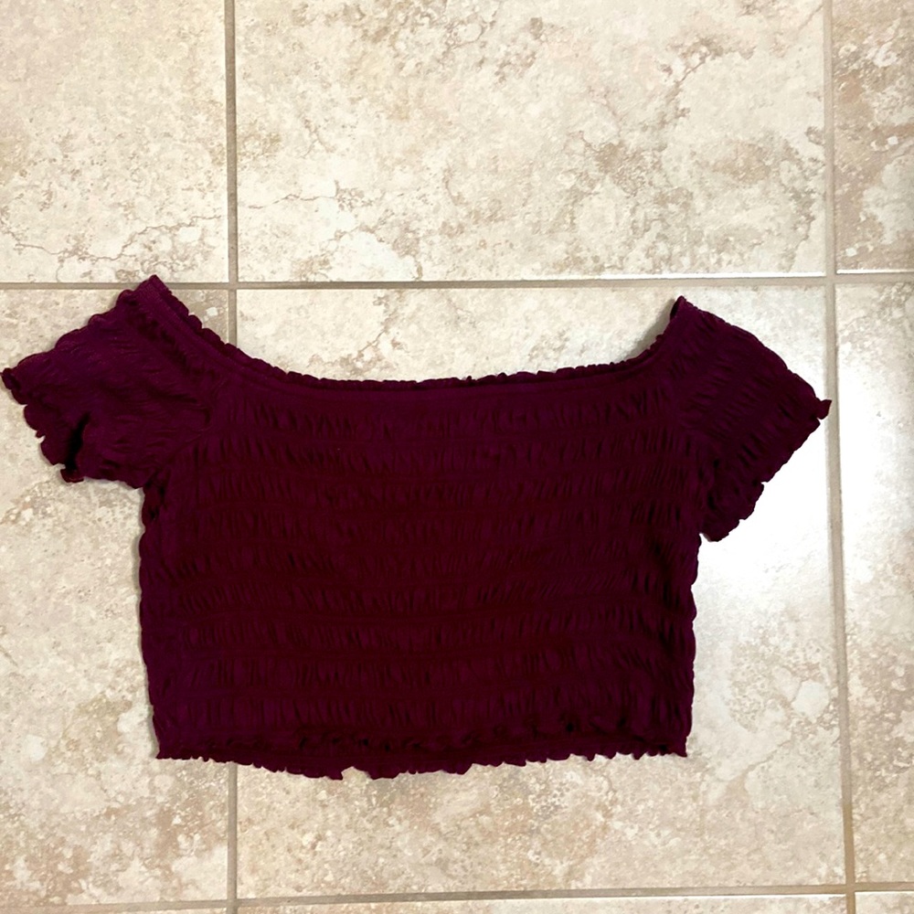 Maroon like color. Off the shoulder crop top.